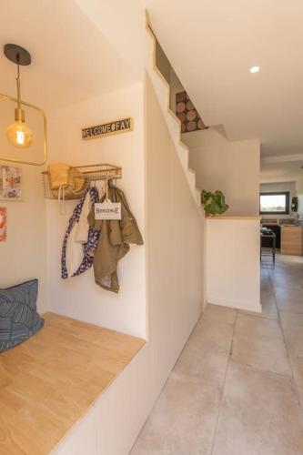 a hallway with a staircase and a living room at Villa Luxe&Nature, 10 mins de Montpellier, 6 personnes in Saint-Jean-de-Védas
