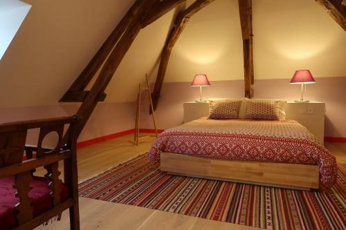 Postel nebo postele na pokoji v ubytování Près des châteaux de la Loire et du zoo de Beauval