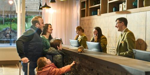 a group of people standing around a counter at Crieff Hydro in Crieff