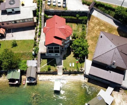 an aerial view of a house with a red roof at Dina apartman Jablaničko jezero in Konjic