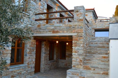 an external view of a stone house at The House of Prince in Nea Stira