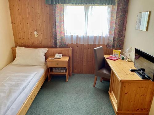 
Ein Bett oder Betten in einem Zimmer der Unterkunft Landhotel Moorhof
