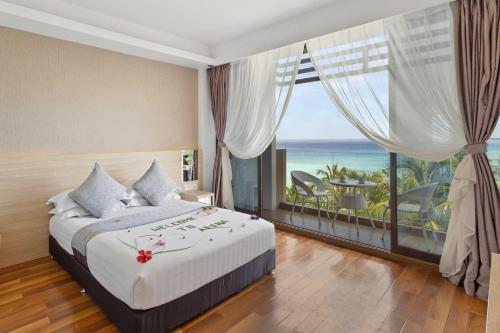 Postel nebo postele na pokoji v ubytování Arena Beach Hotel