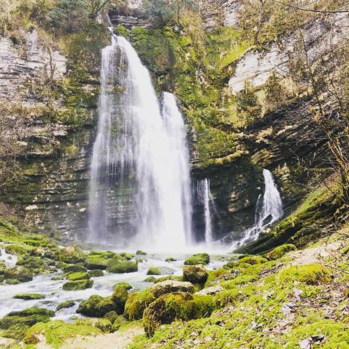 a waterfall on the side of a river at Les balcons de Cuttura 1 & SPA chez Ô JurassiK in Cuttura