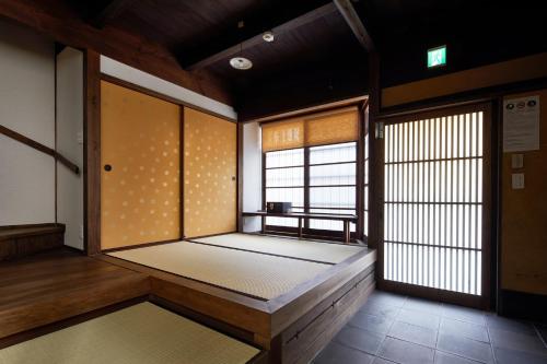 an empty room with a large room with a window at Tachibana an in Kyoto