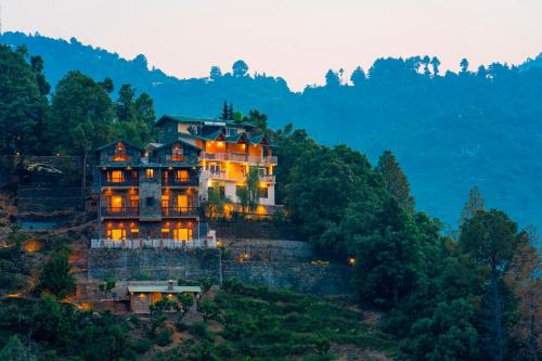 a large house on top of a hill at Zostel Homes Ramgarh, Nainital in Rāmgarh