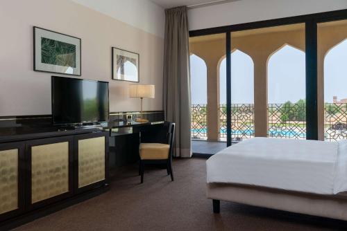 a hotel room with a large window overlooking the ocean at Radisson Blu Hotel N'Djamena in NʼDjamena