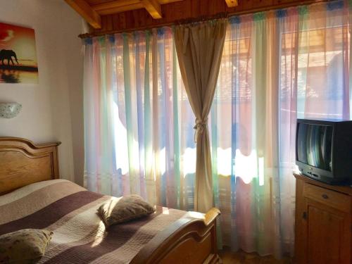 TV a/nebo společenská místnost v ubytování Rolling Stone Hostel