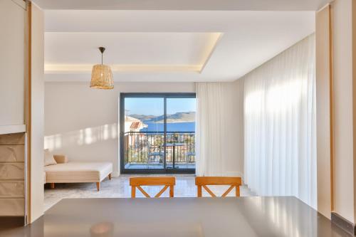a living room with a view of the ocean at Sole Vista Homes in Kas