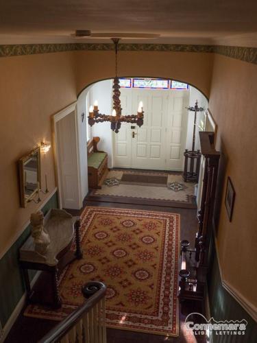 a hallway with a door leading to a house at Kill House, Kingstown in Clifden