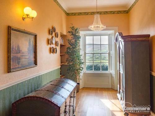 a room with a bench and a window at Kill House, Kingstown in Clifden