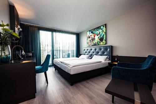 Postel nebo postele na pokoji v ubytování Hotel Der Blaue Reiter