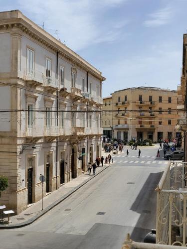 an empty street in a city with buildings at varcOrtigia Bed and Breakfast in Siracusa