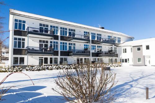 an apartment building with snow on the ground at Luxury Apartments Winterberg in der alten Schule in Winterberg