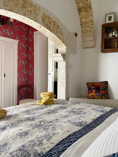a bedroom with a large bed in a room at Villa in Gargano - VILLA BASSO in Monte SantʼAngelo