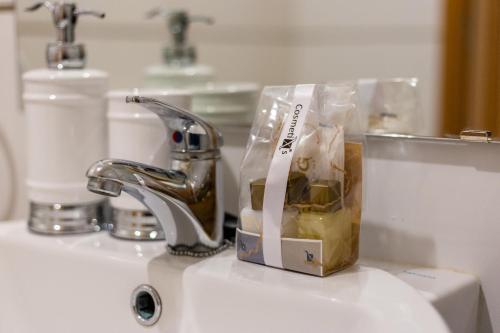 a bag of food sitting on top of a sink at Sunshine apartment by Ammonite&Cо in Olhão