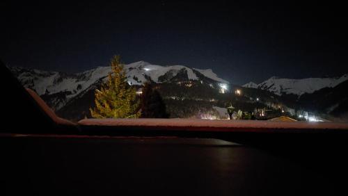 a view of a snow covered mountain at night at Kranzmuehle - Ankommen am Achensee in Achenkirch