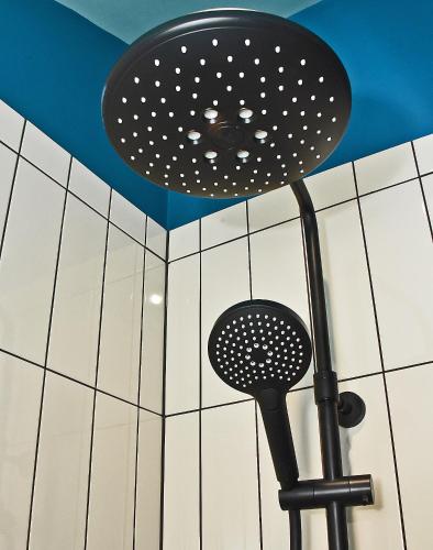 a shower head in a bathroom with a ceiling at Masonic Arms Gatehouse in Gatehouse of Fleet