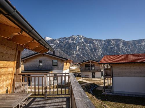 a view from the balcony of a house with mountains in the background at Chalet Charivari Inzell, Inzell in Inzell