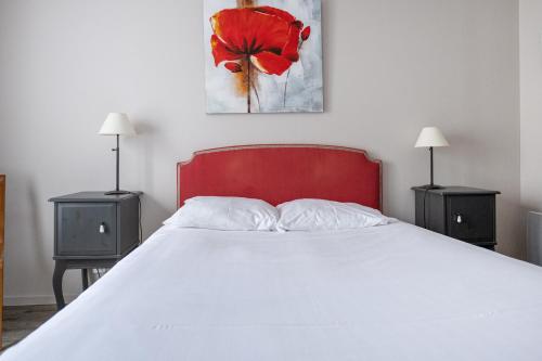 En eller flere senge i et værelse på Gîte Rogonde