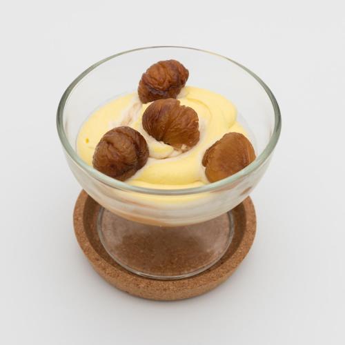 a glass bowl of food with nuts on it at Hotel Lumin in Cremia