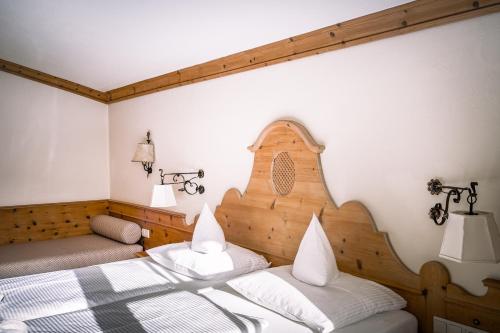 Letto o letti in una camera di Hotel Tirolerhof - Familotel Zugspitze