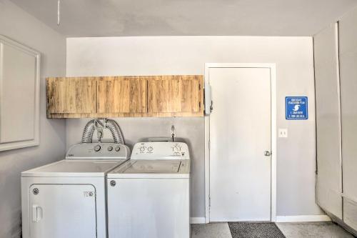 a kitchen with a washer and dryer in a room at Heated Pool and Lanai Matlacha Isles Getaway in Matlacha