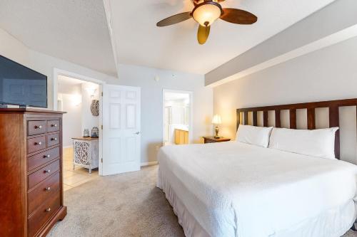 a bedroom with a bed and a ceiling fan at Dunes of Seagrove A104 in Santa Rosa Beach