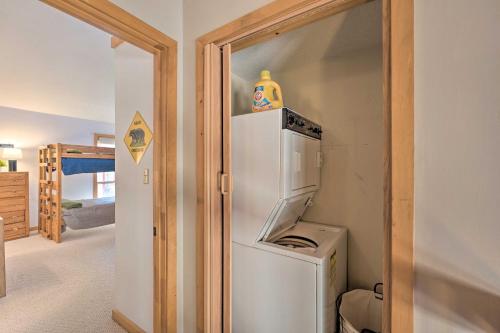 a kitchen with a refrigerator and a washer and dryer at Lincoln Station Escape - Walk to Restaurants! in Lincoln