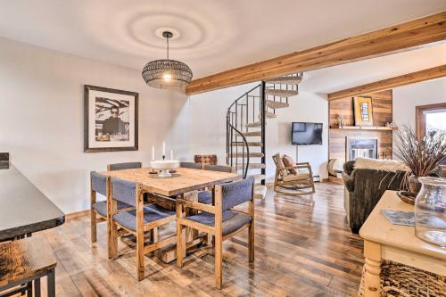 a dining room and living room with a table and chairs at Private Balcony and Resort Perks Silverthorne Condo in Silverthorne