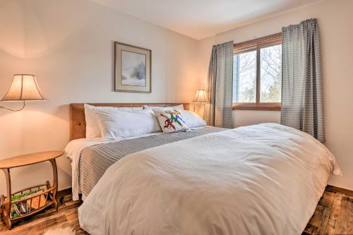 a bedroom with a bed and a window at Private Balcony and Resort Perks Silverthorne Condo in Silverthorne