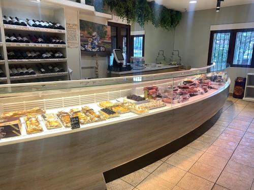 a bakery counter with many different types of pastries at Hotel Langa in Cerezo de Abajo