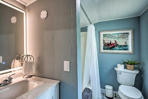 a bathroom with a sink and a toilet and a tub at Unique Historic Cottage - Walk to Main St! in Sutter Creek