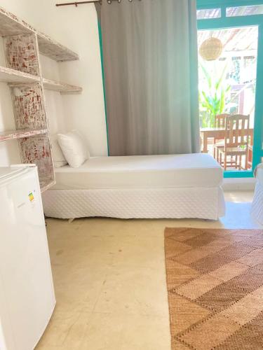 Katil atau katil-katil dalam bilik di Pousada Vila das Águas