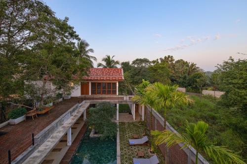 an aerial view of a house with a swimming pool at Arachchi Heritage in Anuradhapura