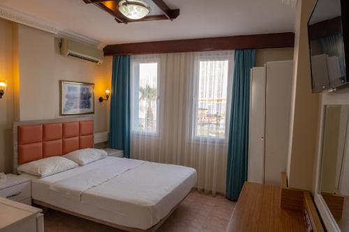 Postel nebo postele na pokoji v ubytování Arden Hotel