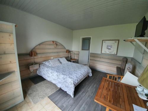 Ένα ή περισσότερα κρεβάτια σε δωμάτιο στο Auberge des etiers chambres d'hôtes