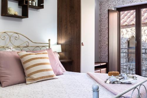 Postel nebo postele na pokoji v ubytování B&B Porta Soprana