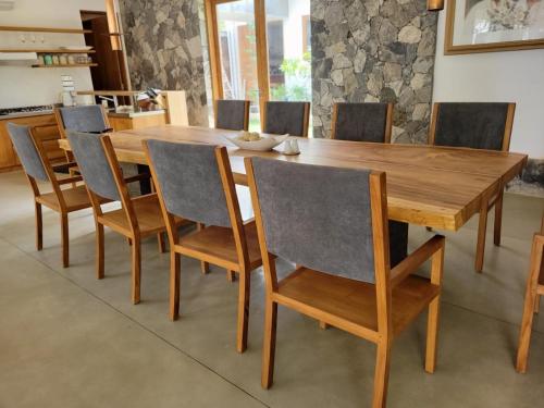 a dining room table and chairs with a wooden table at Arachchi Heritage in Anuradhapura