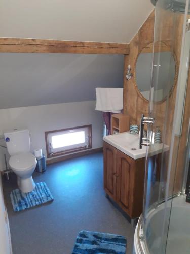 a bathroom with a toilet and a sink and a shower at Yacht Club in Liepāja