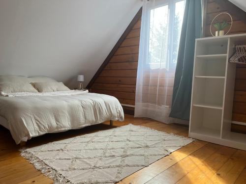 Ένα ή περισσότερα κρεβάτια σε δωμάτιο στο Chalet du Trèfle