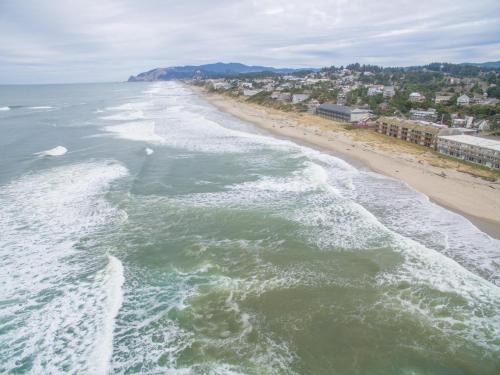 an aerial view of the ocean and a beach at Sea Gypsy 318 in Lincoln City