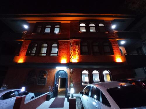 a building with a car parked in front of it at MİLENYUM HOUSE SUİT in Ankara