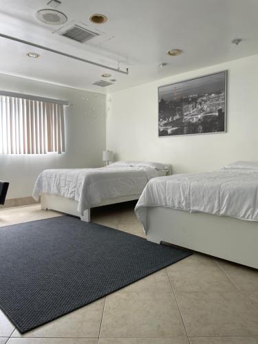 Postel nebo postele na pokoji v ubytování Culver City Hostel