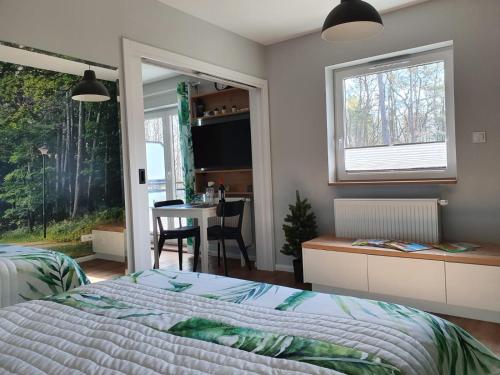 Postel nebo postele na pokoji v ubytování Green Apartment Międzywodzie