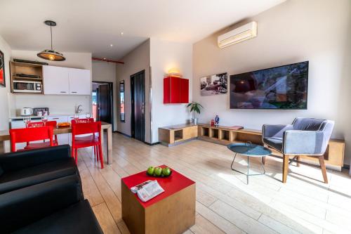 a living room with a couch and a table at Ben Yehuda Apartments in Tel Aviv