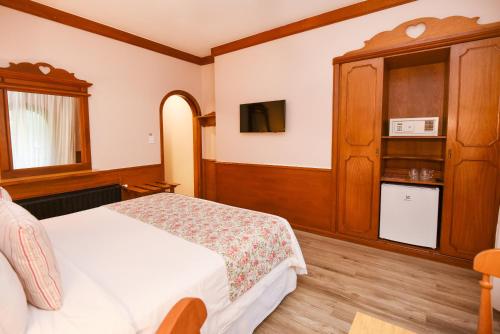 Hotel das Hortênsiasにあるベッド