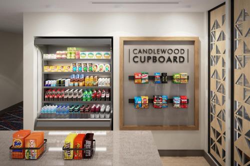 a soda machine in a grocery store with a drink at Candlewood Suites - Columbia by IHG in Columbia