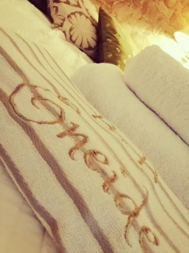 a white blanket with the word comfort written on it at Eneide in Palmi