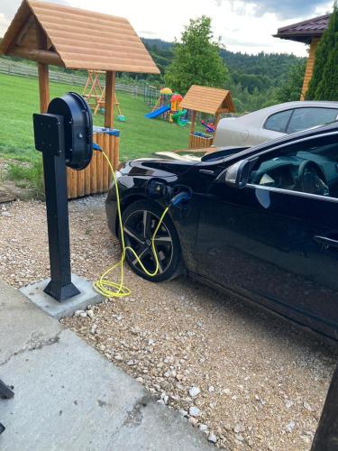 a car is plugged into a parking meter at Casa Bradet in Întorsura Buzăului